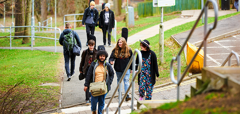 students walking up the campus stairs to Brahan students walking up the campus stairs to Brahan