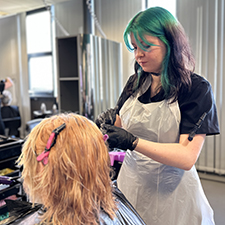 hairdressing student colouring hair