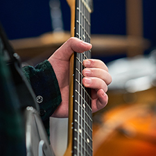 student playing guitar